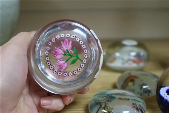 A collection of six paperweights